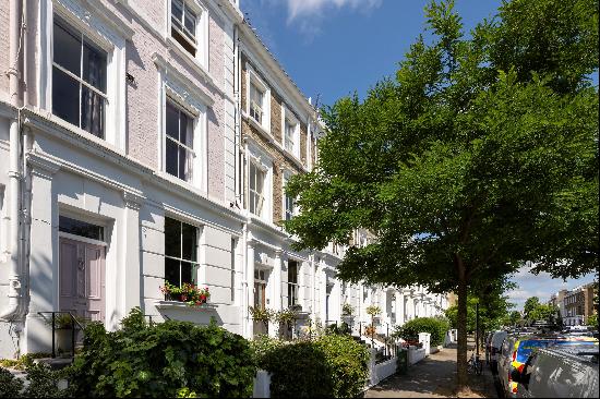 A four-bedroom family house situated on a quiet street in Holland Park. The house benefits