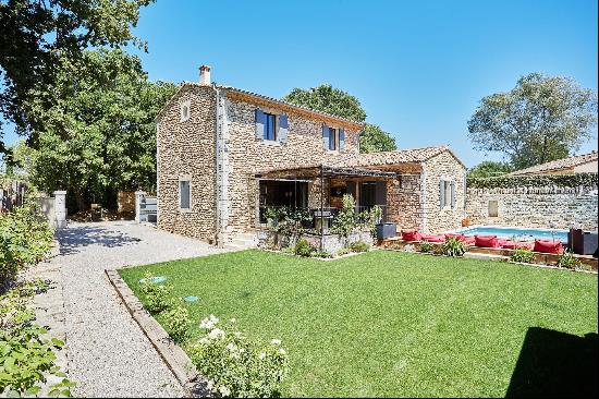 A charming house with a swimming pool and garden.