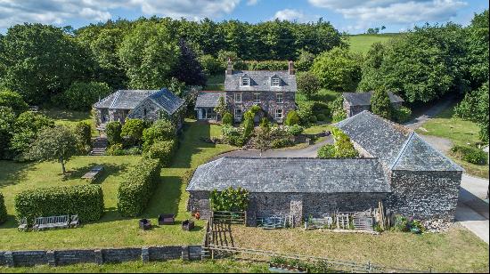 A beautiful family home, with a separate three bedroom cottage, several stone outbuildings