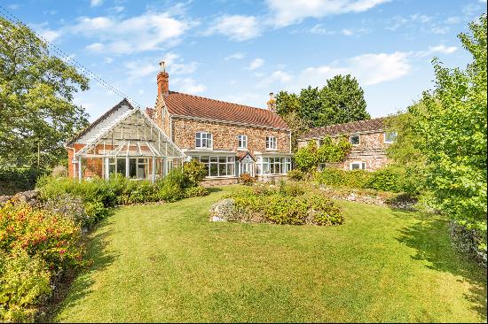 A period farmhouse complete with a large 2 bedroom annex, a range of outbuildings and land