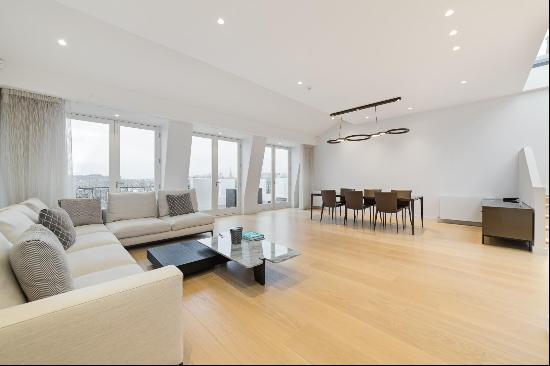 An impressive three bedroom duplex penthouse with direct lift access and a large roof terr