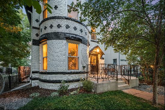 Indulge in the allure of a meticulously revitalized Queen Anne Victorian 