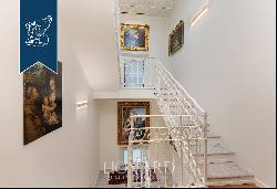 Austere and imposing in its majestic neoclassical architecture, this prestigious private e