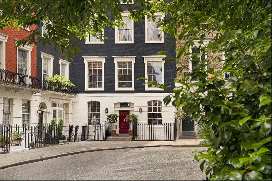 Double fronted Georgian townhouse in enviable garden square in Connaught Village