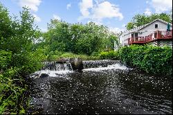 Own a Piece of History on .74 Acre with Falls River Waterfront!