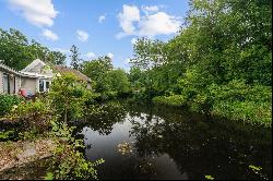 Own a Piece of History on .74 Acre with Falls River Waterfront!