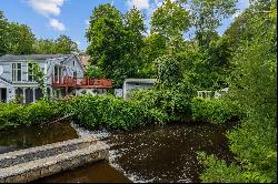 Own a Piece of History on .74 Acre with Falls River Waterfront!