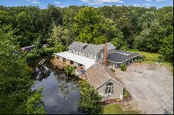 Own a Piece of History on .74 Acre with Falls River Waterfront!