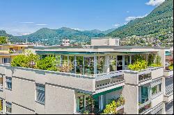 Lugano-Castagnola: elegant penthouse apartment for sale, offering expansive panoramic vie