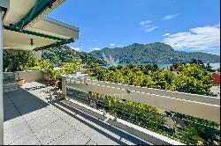 Lugano-Castagnola: elegant penthouse apartment for sale, offering expansive panoramic vie