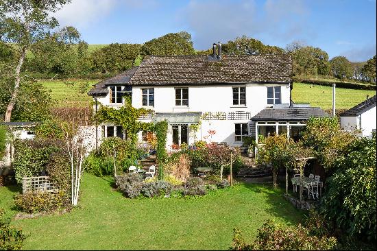 A beautiful south-facing home which is full of character with far-reaching views over the 