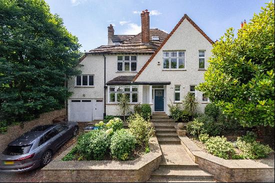 A five / six bedroom, five bathroom link detached house for sale with a south west facing 