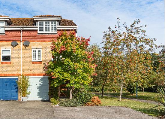 A stunning four bedroom townhouse, with direct views over the Chipstead Lakes, located in 