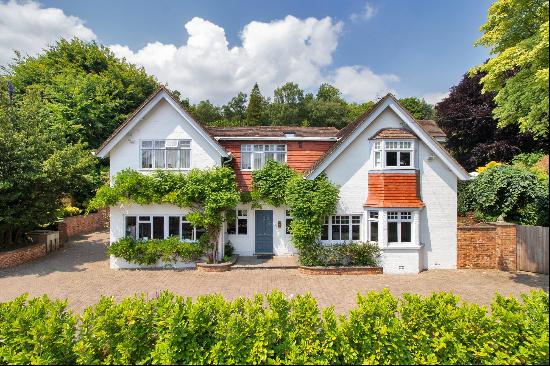 A recently updated family home set in mature gardens located just outside Sevenoaks with i