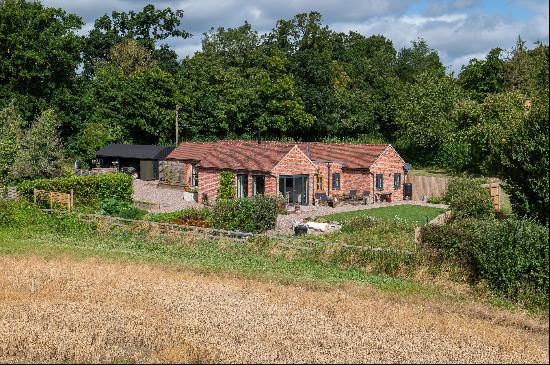 A lovely barn conversion on the edge of the village with open south-facing views in a most