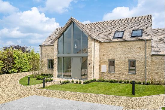 A beautifully finished four bedroom barn style home within an exclusive gated development 