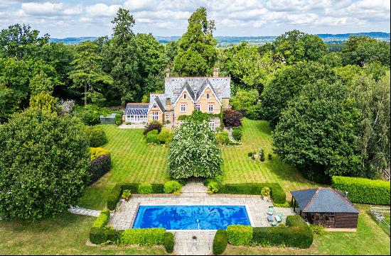 A picturesque and striking Victorian country house set in expansive grounds with swimming 