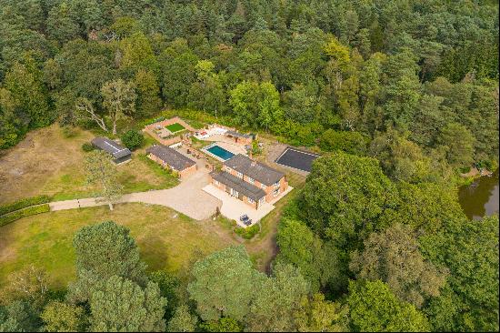 A wonderful family home set in two acres within a wooded setting in Chobham.