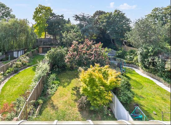 This beautiful family home is located on one of the river roads in Teddington.This period