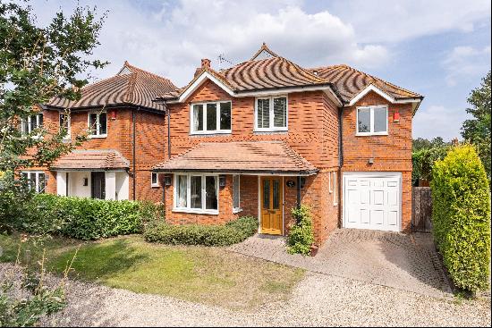 A beautifully presented four bedroom detached house with off street parking near Cobham Fr