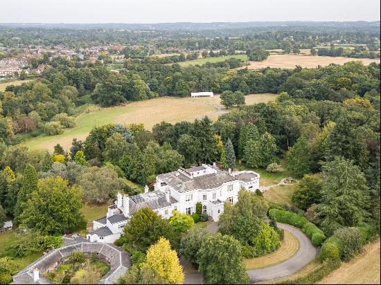 An impressive character home with a gated entrance onto Painshill Park.