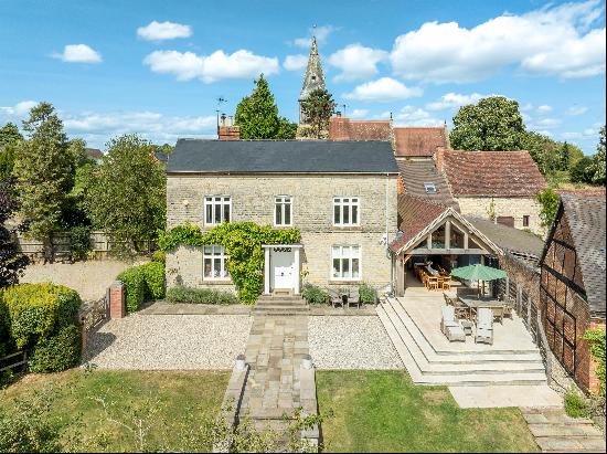 In the heart of the village, backing on to open fields, Church House is an immaculate home