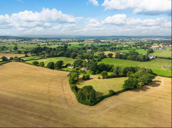 Two wonderful country properties surrounded by approximately 15.35 acres with a range of o