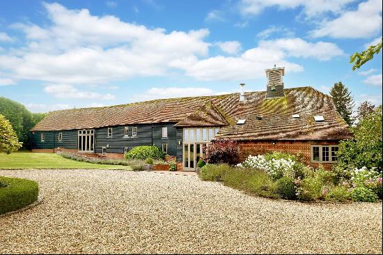 An outstanding converted barn with exceptional interiors offering fabulous space and desig