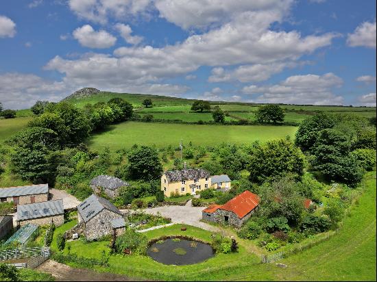 A 17th century farmstead with wonderful views and in just over 9 acres, set in an enchanti