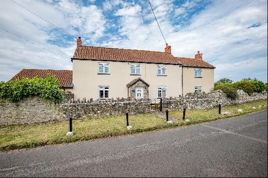 A detached former farmhouse situated along a country lane with a lovely southfacing view 