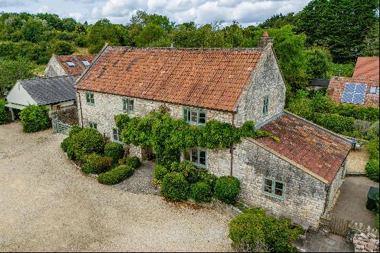 A pretty detached 4 bedroom barn conversion, in a charming position within Priston village