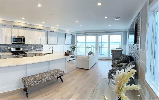 Enjoy beautiful sunsets in this brand new waterfront, modern apartment. 3 Bedrooms, 2.5 ba