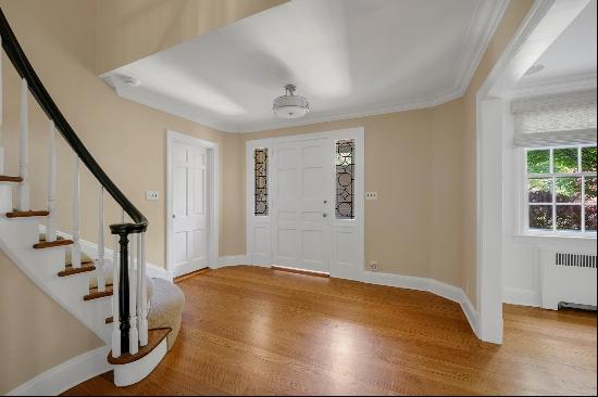 Nestled on one of Manhasset's most prestigious streets in the village of Flower Hill, 65 E