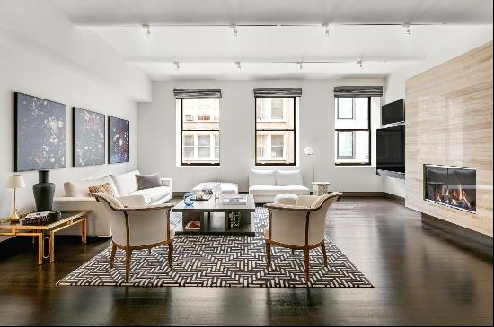 Experience the epitome of luxury loft living in this magnificent Soho residence nestled