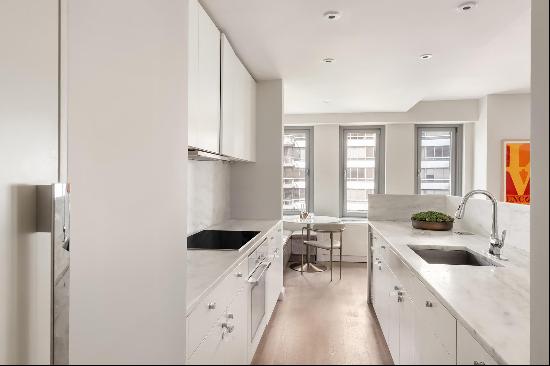 This beautifully renovated 2-bedroom, 2.5-bathroom duplex offers stunning western views