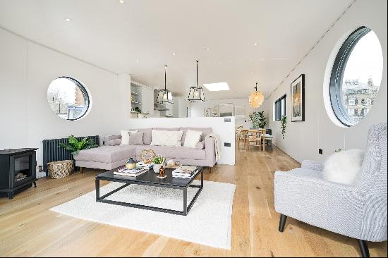 Enjoy beautiful views of the River Thames from this private deck area of this bright and s