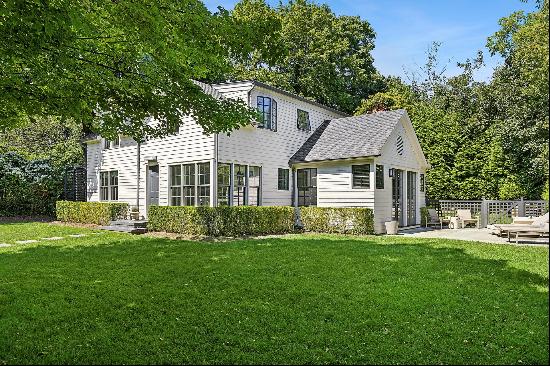 Discover elegance behind the gates of this fully renovated Southampton Village home. Seaml