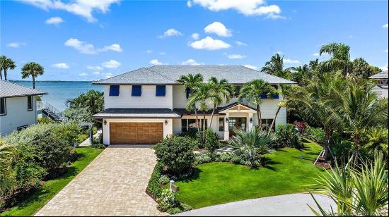 Welcome to your coastal sanctuary in Joe's Point on Hutchinson Island. This stunning water