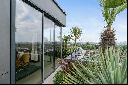 Luxury penthouse with floor-to-ceiling windows.