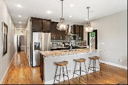 Welcome to this Exquisitely Renovated Half-Duplex!