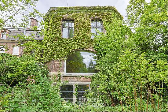 spacious mansion surrounded by a garden