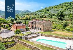 Renovated farmhouse with a swimming pool, olive grove and panoramic view just outside the 