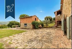 Renovated farmhouse with a swimming pool, olive grove and panoramic view just outside the 