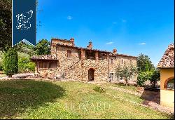 Renovated farmhouse with a swimming pool, olive grove and panoramic view just outside the 