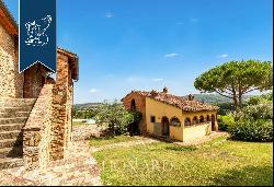 Renovated farmhouse with a swimming pool, olive grove and panoramic view just outside the 