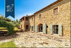 Renovated farmhouse with a swimming pool, olive grove and panoramic view just outside the 