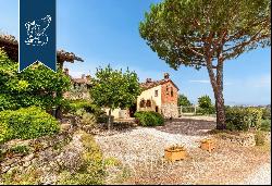 Renovated farmhouse with a swimming pool, olive grove and panoramic view just outside the 