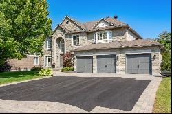 Private Yard + Heated 3-Car Garage