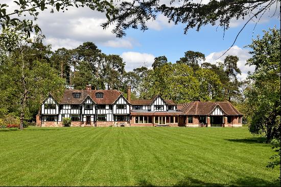 A beautifully maintained family country house in a private wooded setting.