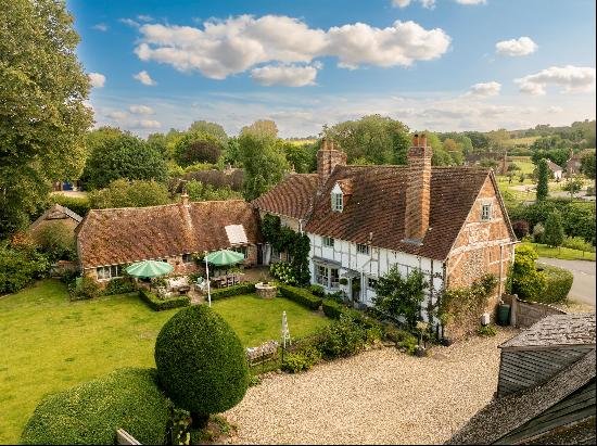 A stunning Grade II listed village house offering excellent family accommodation set in a 